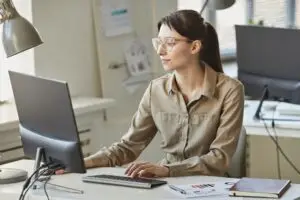 woman researching on a computer
