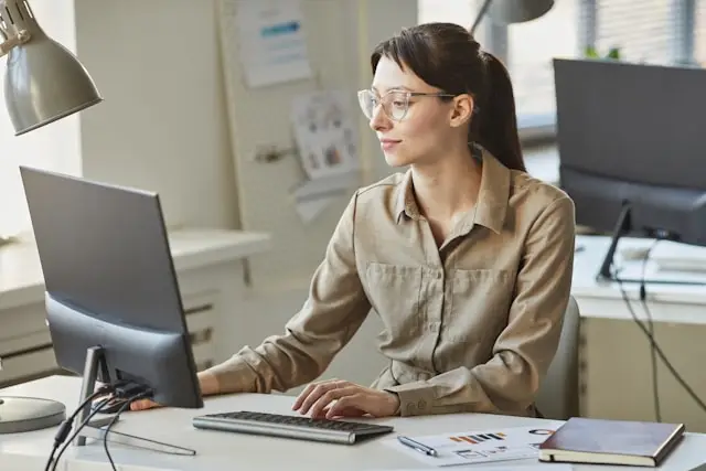 woman researching on a computer